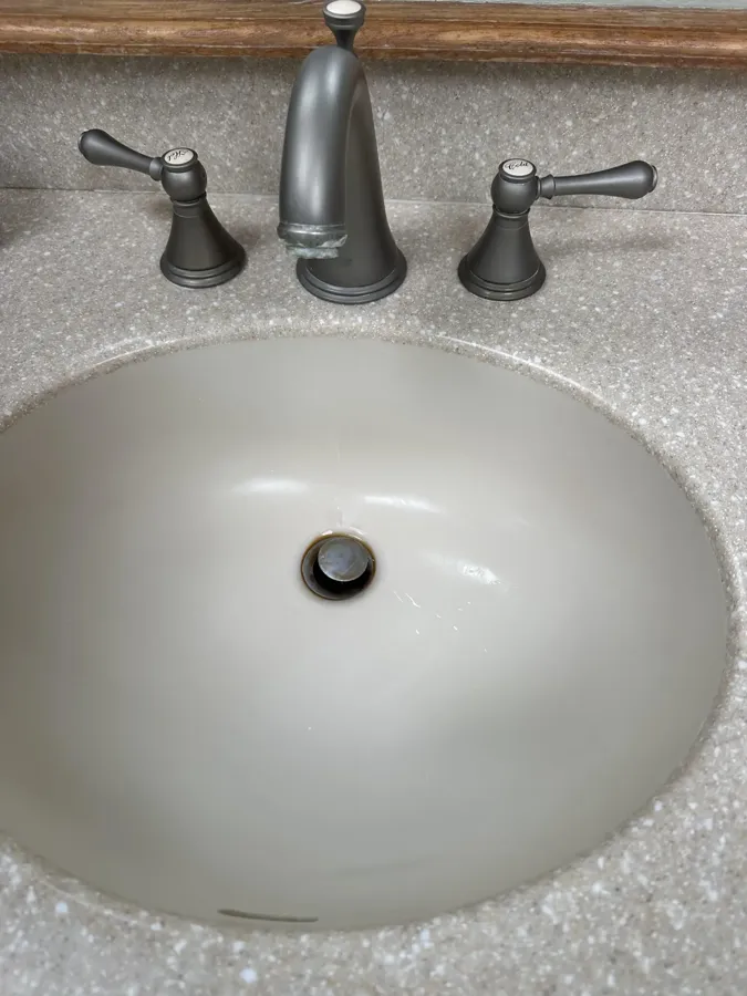 Bathroom sink and fixtures after, spotless and polished Bathroom sink and fixtures after, spotless and polished